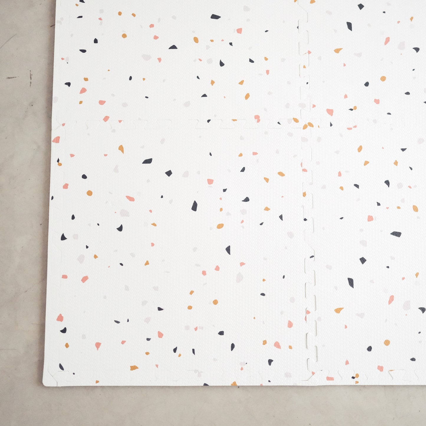 Terrazzo on white play mat