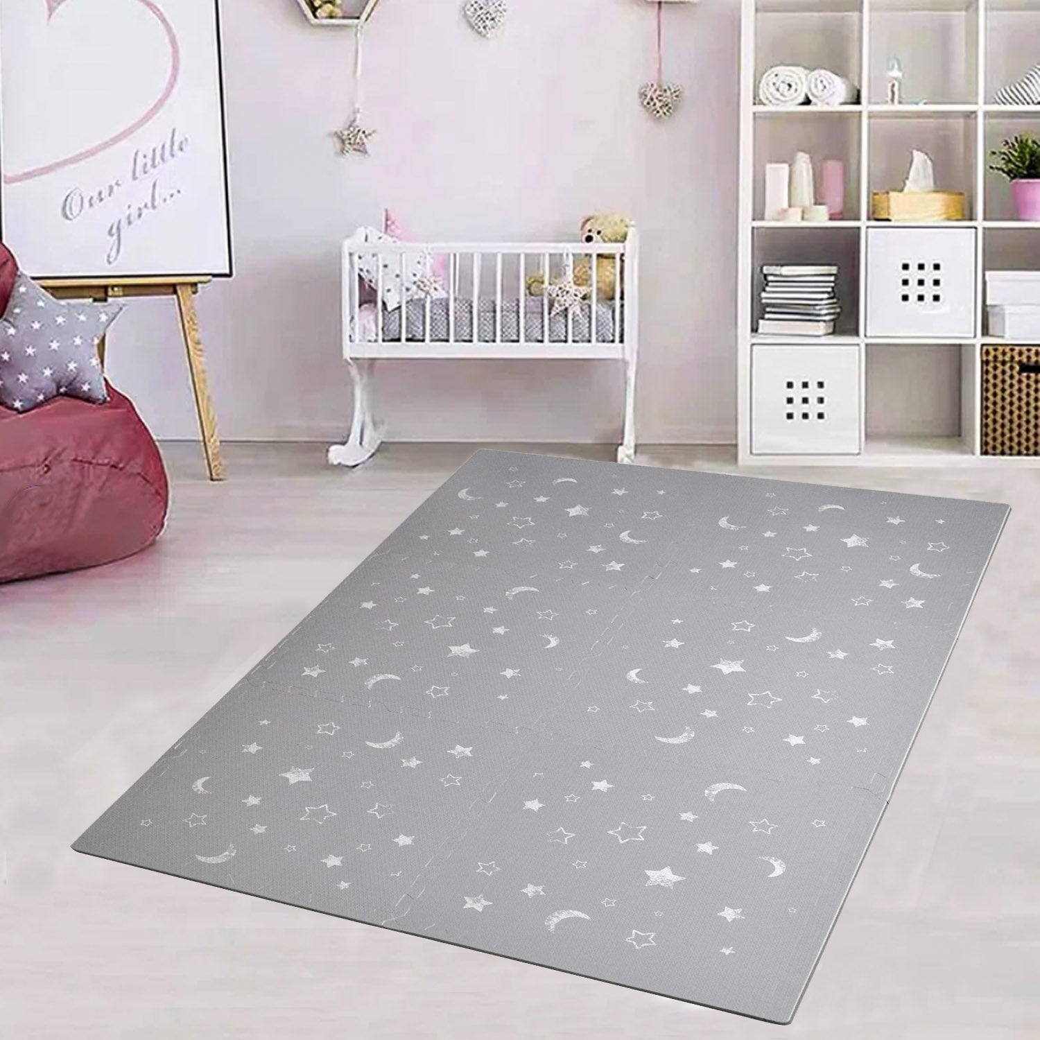 grey play mat with moons and stars in grey and white
